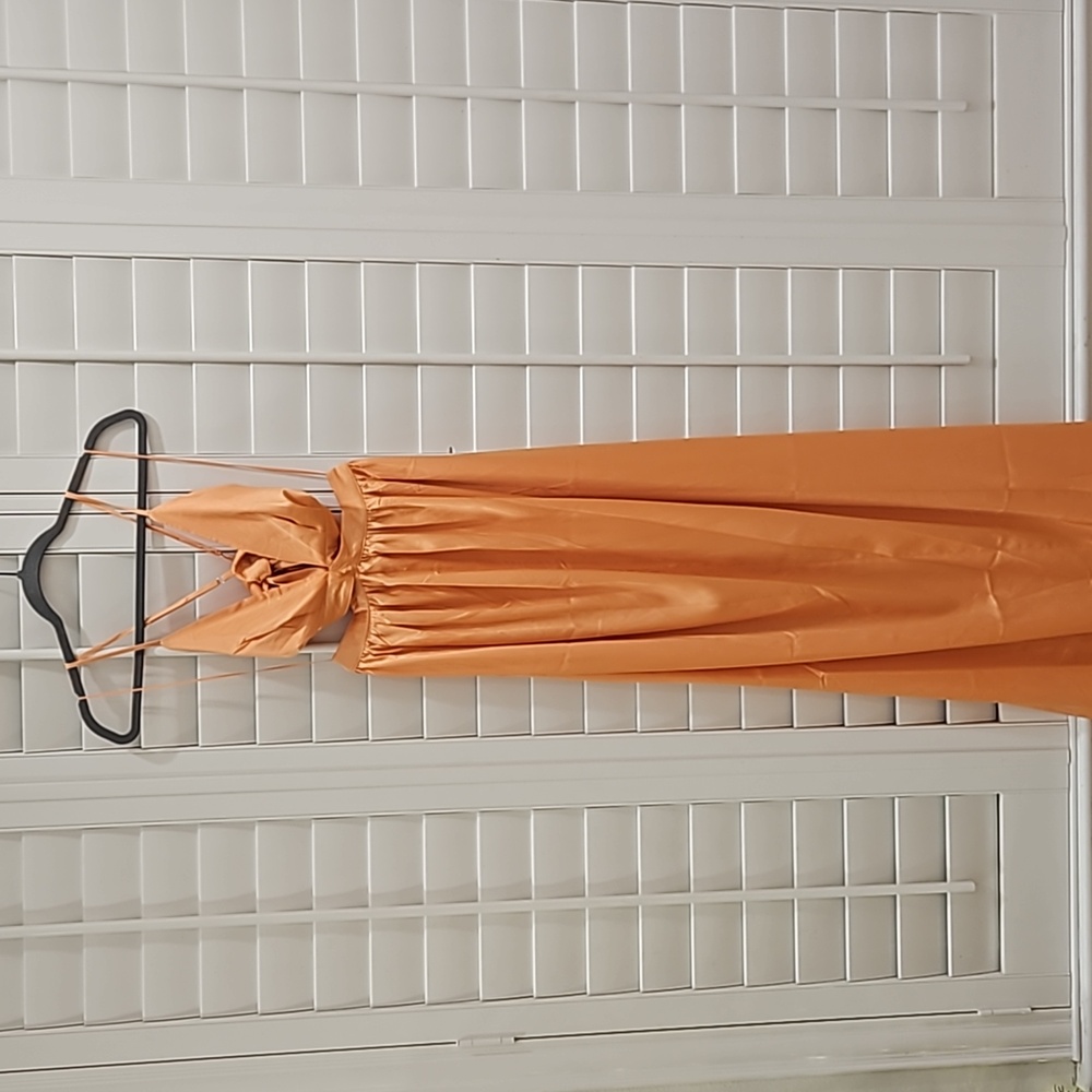 Orange flowy dress with side cut outs
